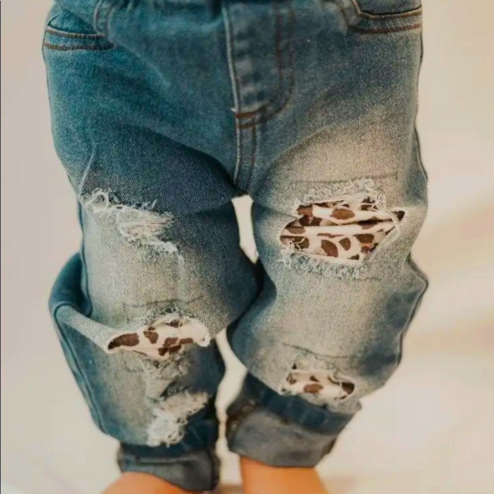 Distressed denim dark wash leopard jeans.